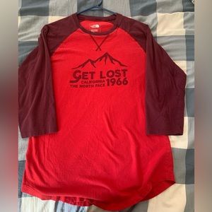 Red men’s north face shirt.